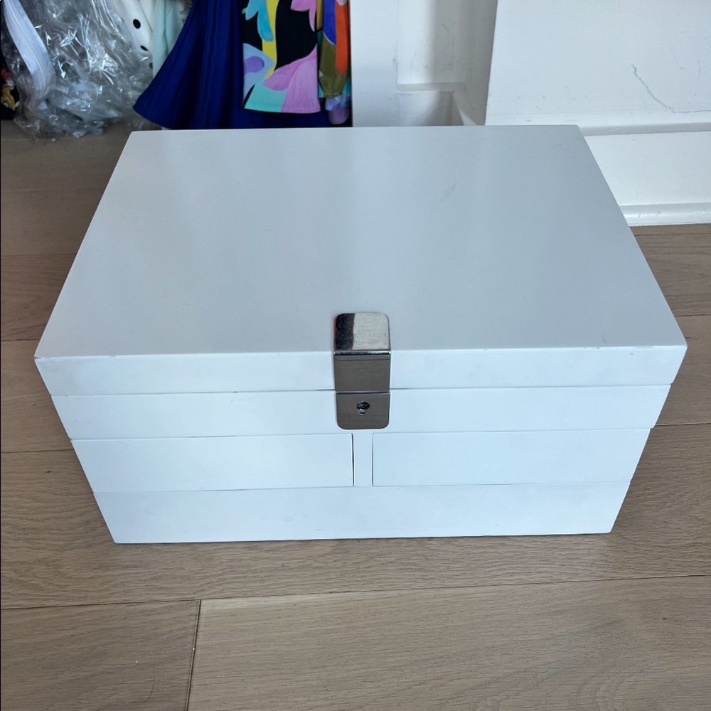 White jewelry box with mirror and four different drawers